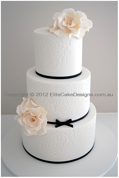 Wedding Cake with ivory roses and camelia decorated cake